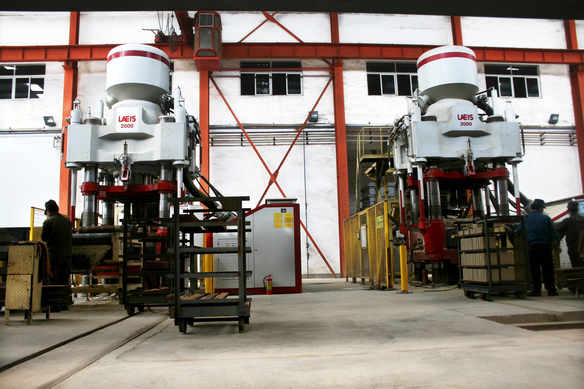Refractory forming presses